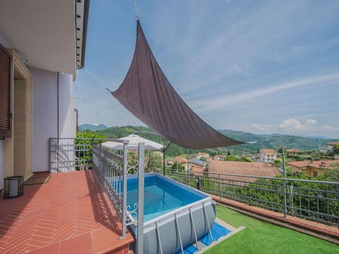 Sky, Plant, Cloud, Property, Building, Shade, Swimming Pool, Outdoor Furniture, House, Urban Design