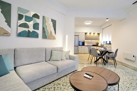 Bright living room with open layout connecting to a modern dining area