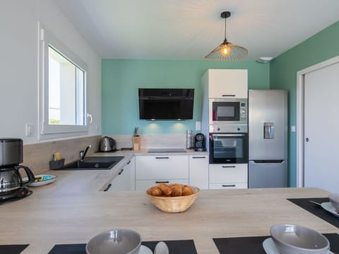 Countertop, Furniture, Kitchen, Kitchen Appliance, Interior Design, Cabinetry, Major Appliance, Flooring, Light Fixture, Home Appliance