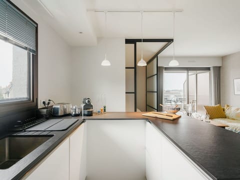 Sky, Building, Plant, Vehicle, Window, Car, Electricity, Slope