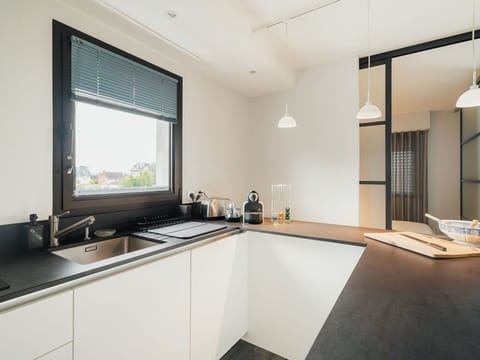 Sky, Building, Plant, Vehicle, Window, Car, Electricity, Slope