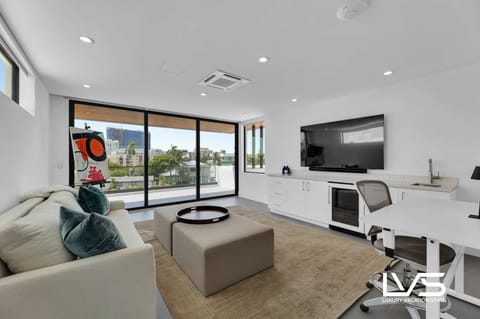 DEN (Water & Pool Views / 3rd Floor) - Queen Sofa Pullout  - Smart TV - Coffee Table  - Computer Table & Swivel Chair  - Wet Bar with fridge & sink.