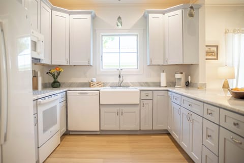 Modern kitchen with refrigerator, oven, stove, microwave, and Keurig 