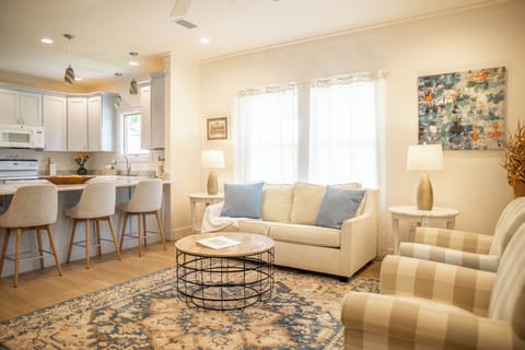Open floorplan kitchen and living room with full-size sofa bed 