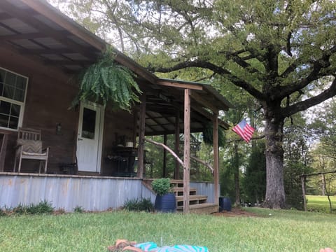 Front porch overlooking the open beautiful yard.