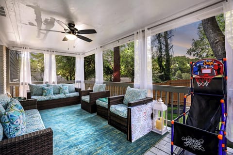 Screened-In Patio with Outdoor TV & Lounge Seat, Perfect for Relaxing in Atlanta