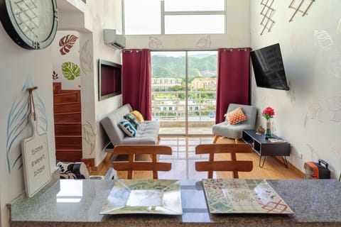 Main living room with 55 inch HDTV, sleeper sofa, AC, balcony. Motorized shade.