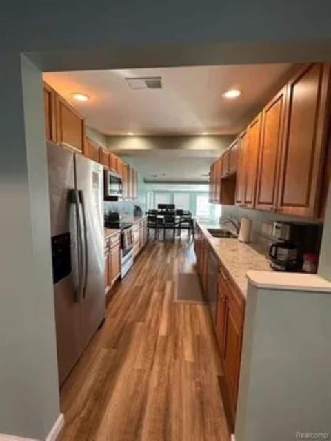 The Gourmet kitchen is stocked with lots of small appliances and cookware.