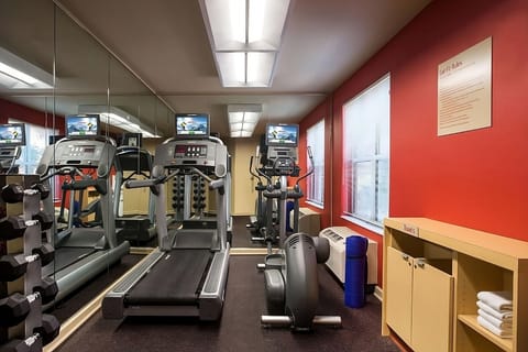 Energize your day with a bright gym and cardio machines.