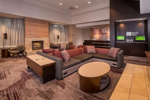 Unwind by the glowing fireplace in a stylish lounge setting