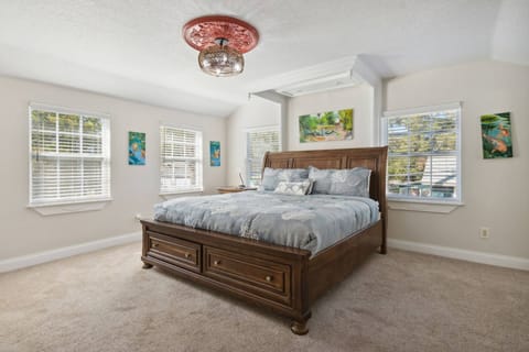 Guest Bedroom: Bright and airy retreat with king bed, artistic decor, and ample natural light!  Smart TV