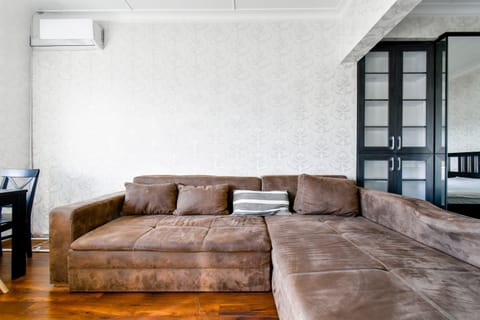 Spacious and inviting living room with a comfortable sofa—perfect for unwinding after a day of exploring.