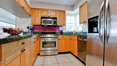Kitchen - Fully stocked kitchen with stainless steel appliances.