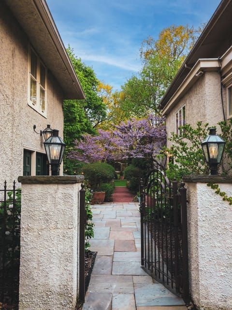 Back gate with view of Carriage House, patio entrance, & back entrance of house