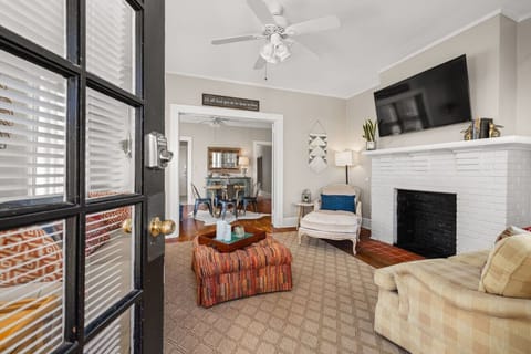 Soak in the sunshine in this open, airy living room, with a snug breakfast spot nearby to ease into your morning.