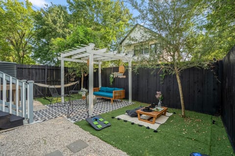 Lush green space, corn hole, and a water fountain—where relaxation and play come together.