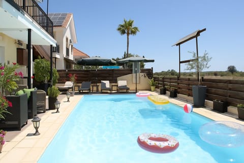 Private pool behind the house, shared with your host and the second guest room