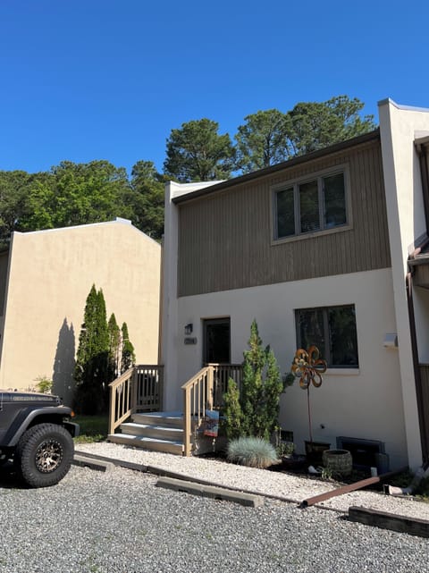 Front view of property with free parking spaces