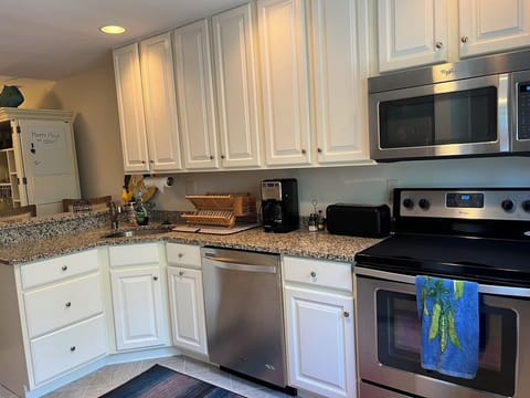 Kitchen complete with dishwasher, microwave, oven, & refrigerator w/icemaker