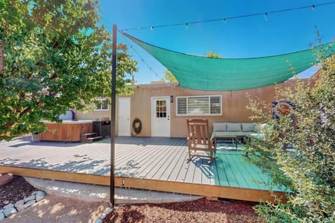 Enjoy our backyard hot tub, patio area, rocking chairs, grill, and games!