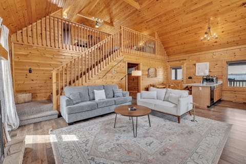 Spacious living area featuring generous seating, a Smart TV, and a cozy fireplace