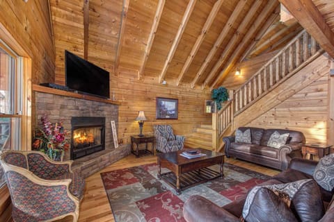 Curl up by the living room’s seasonal fireplace & enjoy a movie night at home