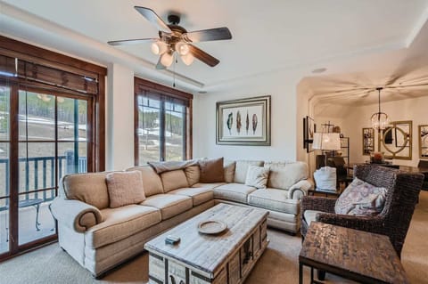 Curl up in the cozy living room & stream your favorites by the fireplace