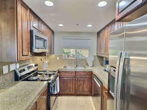 The kitchen is equipped with chef-grade appliances and fully stocked with everything you need to whip up delicious meals!