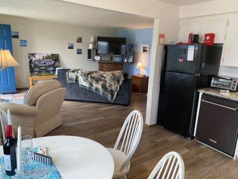 Wide open space to visit and share from the kitchen/dining area to the living room.