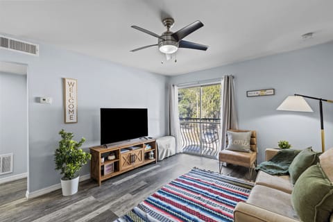 Living room with SMART, books, Board games, House Manual, and Portable inflatable bed. (1)