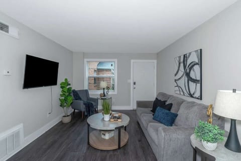 Comfortable Buckhead apartment living area with smart TV and ample seating.