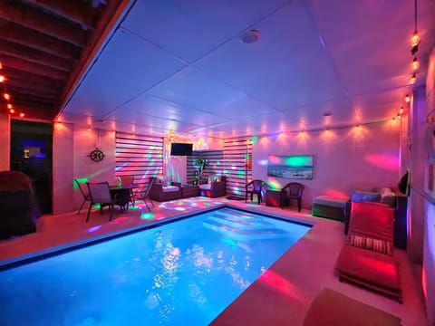 Grotto style pool with water view.