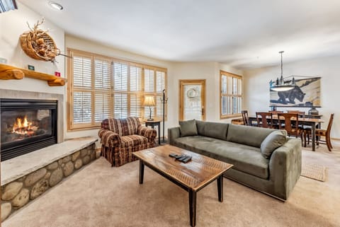 Living Room: 2 couches, 1 pull-out bed, oversized chair, gas fireplace, 39” TV