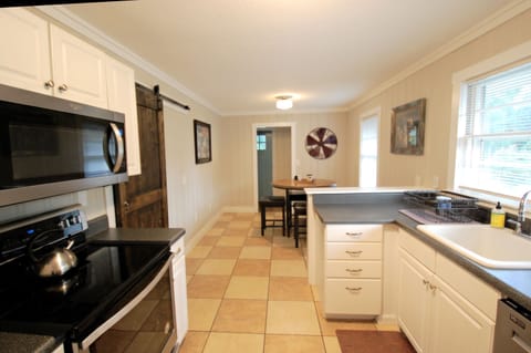 Galley kitchen with pantry space and updated appliances