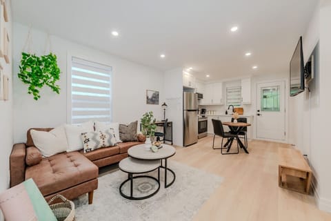 Cozy and modern living room with sleek design, perfect for relaxing in a compact yet inviting space. Enjoy the warm ambience and thoughtful decor for a comfortable stay.