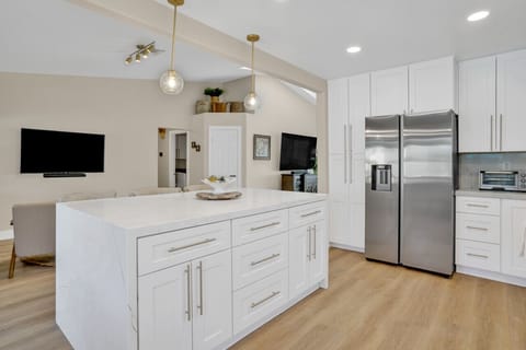Stylish kitchen with a large TV