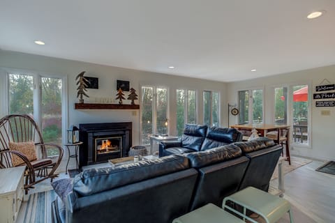 Sunroom with views of the Park and wood burning fireplace and other eating area