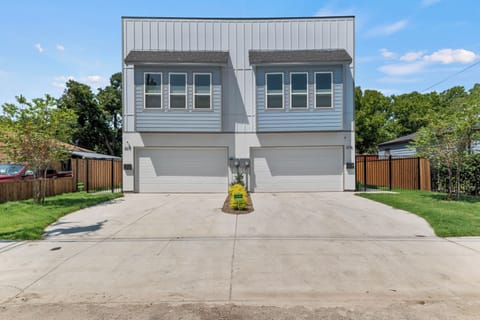 Guest Home is on the right side. Attached 2-car garage + driveway for 2 cars.