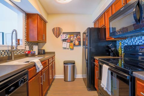 Kitchen with toaster, drip coffee maker, dishwasher, blender and more