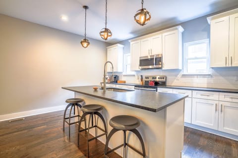 Modern kitchen with toaster, Keurig coffee maker, blender, and more