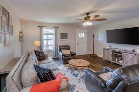 Cozy and spacious living area with TV