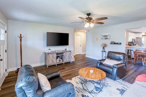 Cozy and spacious living area with TV