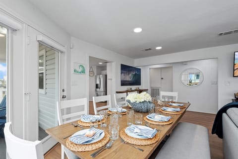 Dine together at the spacious formal dining table accommodating up to 10, setting the scene for delightful moments. 