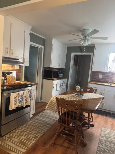 Full kitchen completely loaded with pots, pans, dishes, cups, silverware, etc