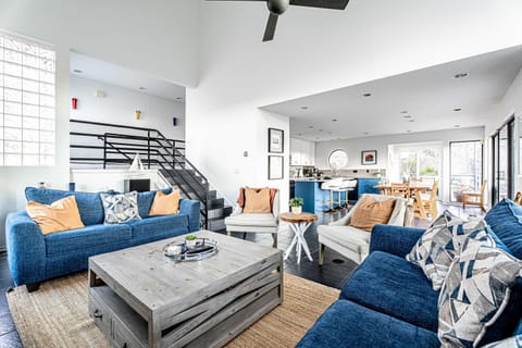 Modern spacious living area with TV and fireplace