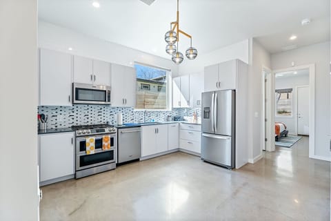 The kitchen is a chef’s dream, offering ample space & every home comfort