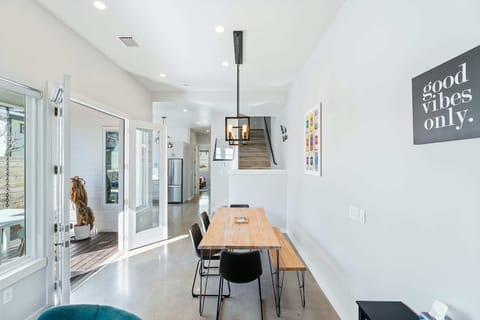 Gather for elegant meals together at the dining table, with space for 7