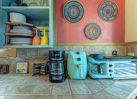 The charming kitchen area offers ample space & all the comforts of home