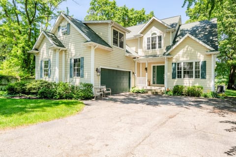 Gorgeous 4 bdrm home nestled on a beautiful wooded lot overlooking Saint Joseph River