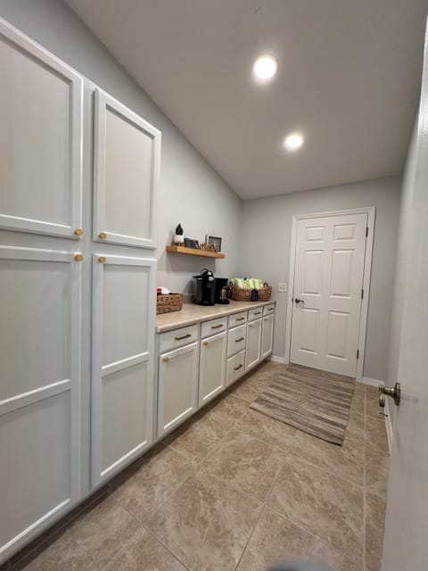 Butlers Pantry with ample storage for food and your everyday needs.